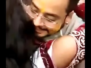 Cute Indian better half kissing publicly